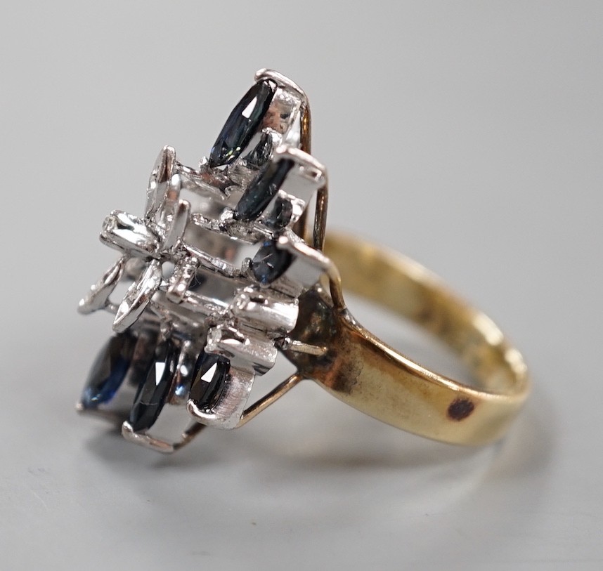 A modern 18k, sapphire and illusion set diamond chip set cluster dress ring, size K, gross weight 8.1 grams.